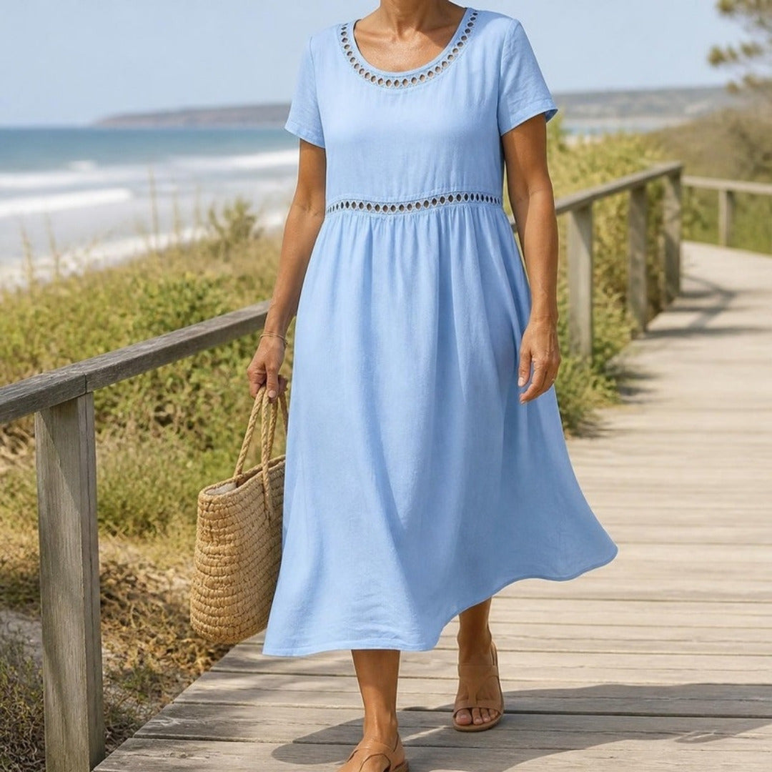 Rosemary midi dress in Light Blue worn on a coastal boardwalk