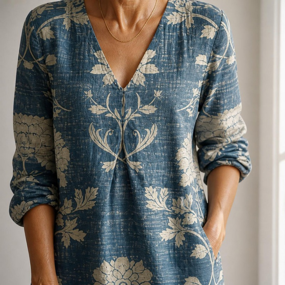 Winifred midi dress close-up of the V-neck, front pleat and side pocket