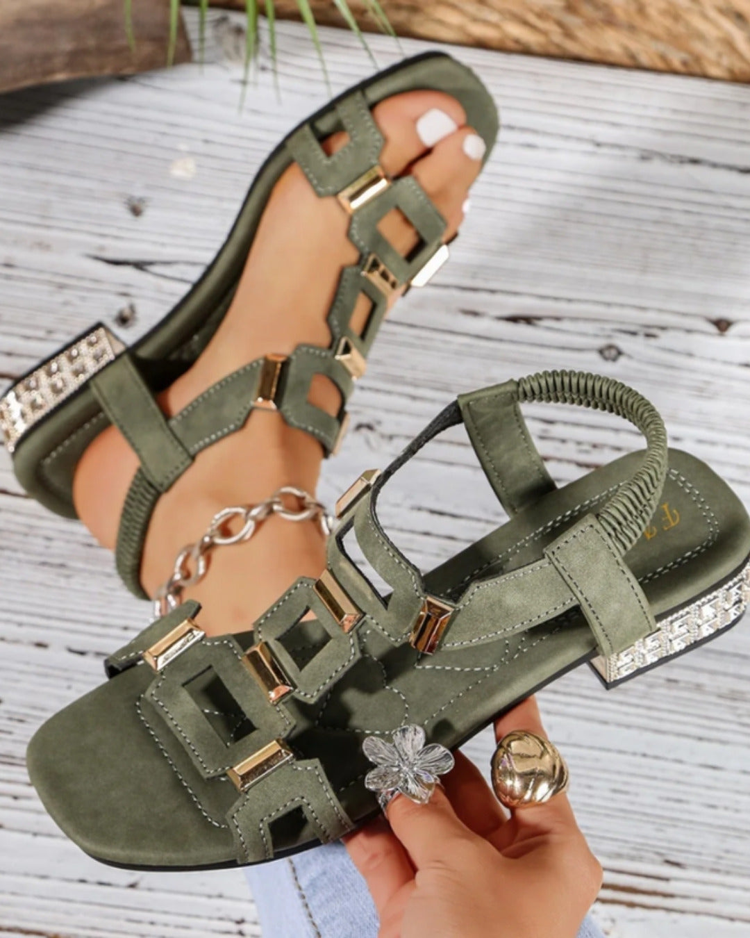 Ottilie sandal held in hand