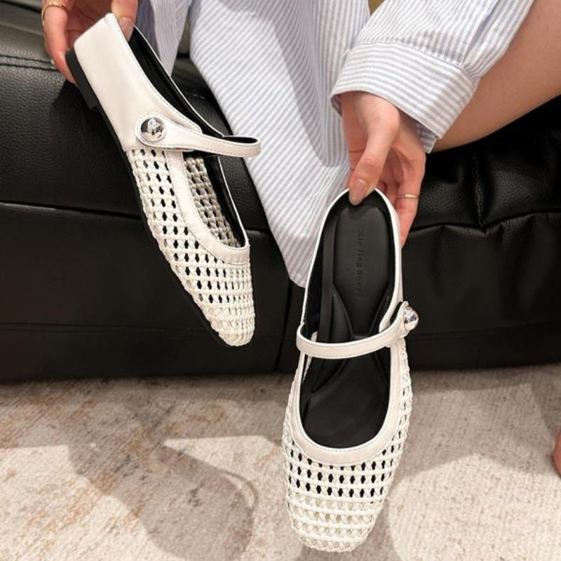 Maisie mule flats in White — pair held in hand