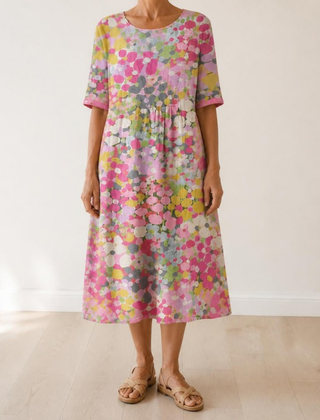 Primrose midi dress in Pink — full front view in a light interior