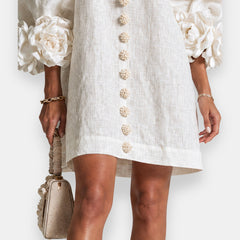 Rosamund Rosette Sleeve Shift Dress in Ivory – hem and button detail