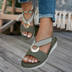Tilda wedge sandals in Green worn on foot, front angle